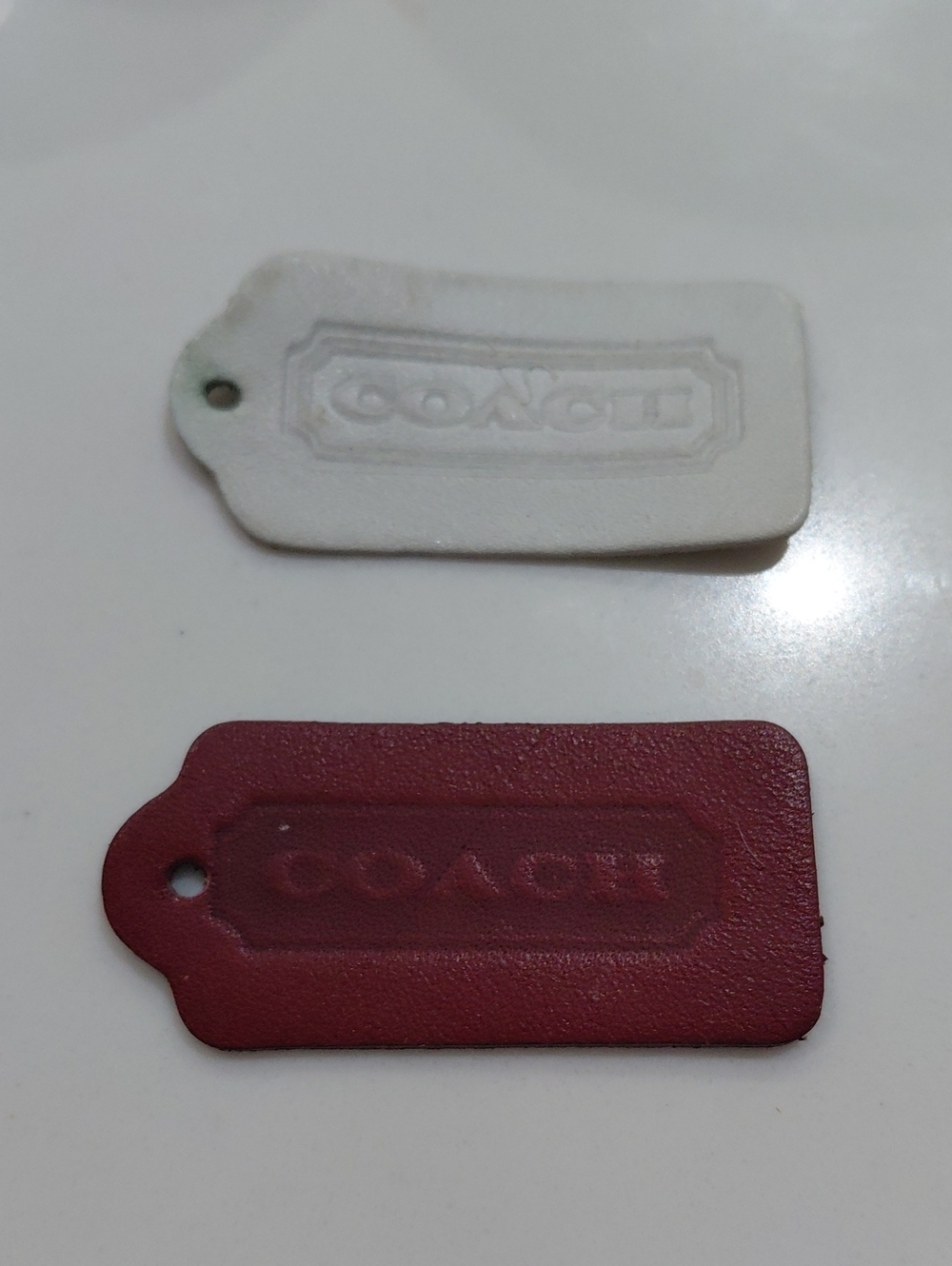2 vintage coach one sided hangtags. One White, And One Burgundy